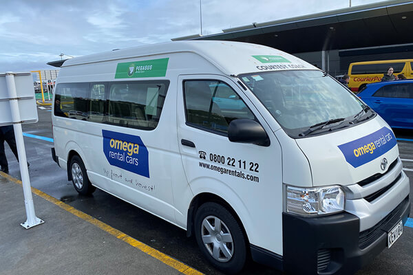 Omega's courtesy shuttle van, pick-up point at the airport. 