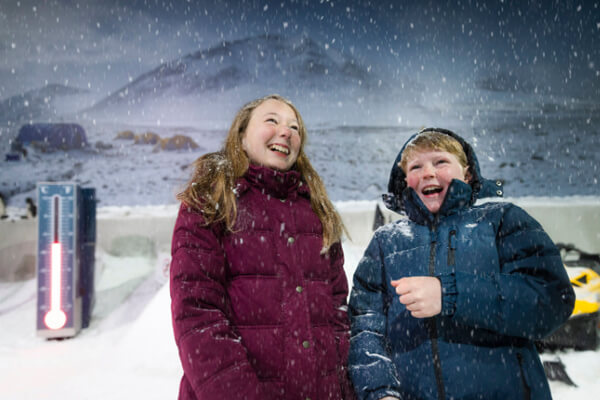 Children enjoying the expereince of a snow storm.