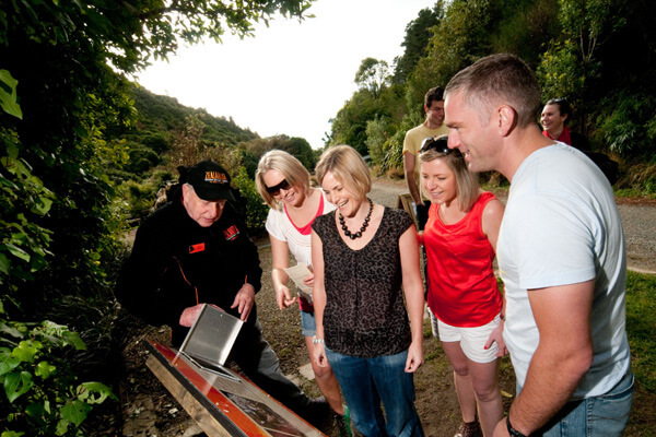Tourists havinga guided tour around Zealandia